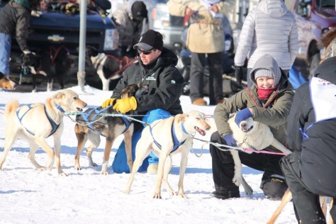 Courtney is all smiles at a dog mushing race.JPG
